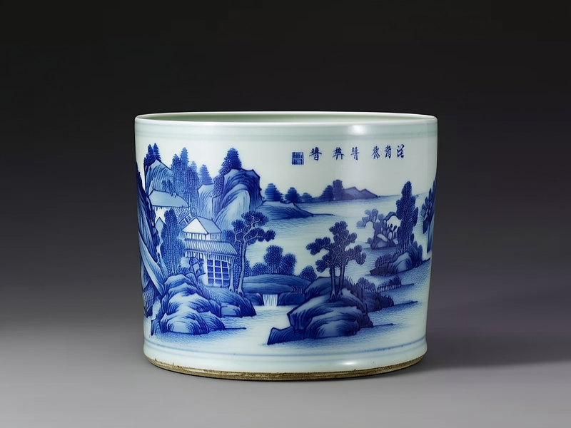 一件清代的青花瓷器，其表面绘有精美的山水画，瓷器的釉色光泽温润，透出岁月的沉淀和历史的痕迹，每一笔每一划都显得那么细腻而...